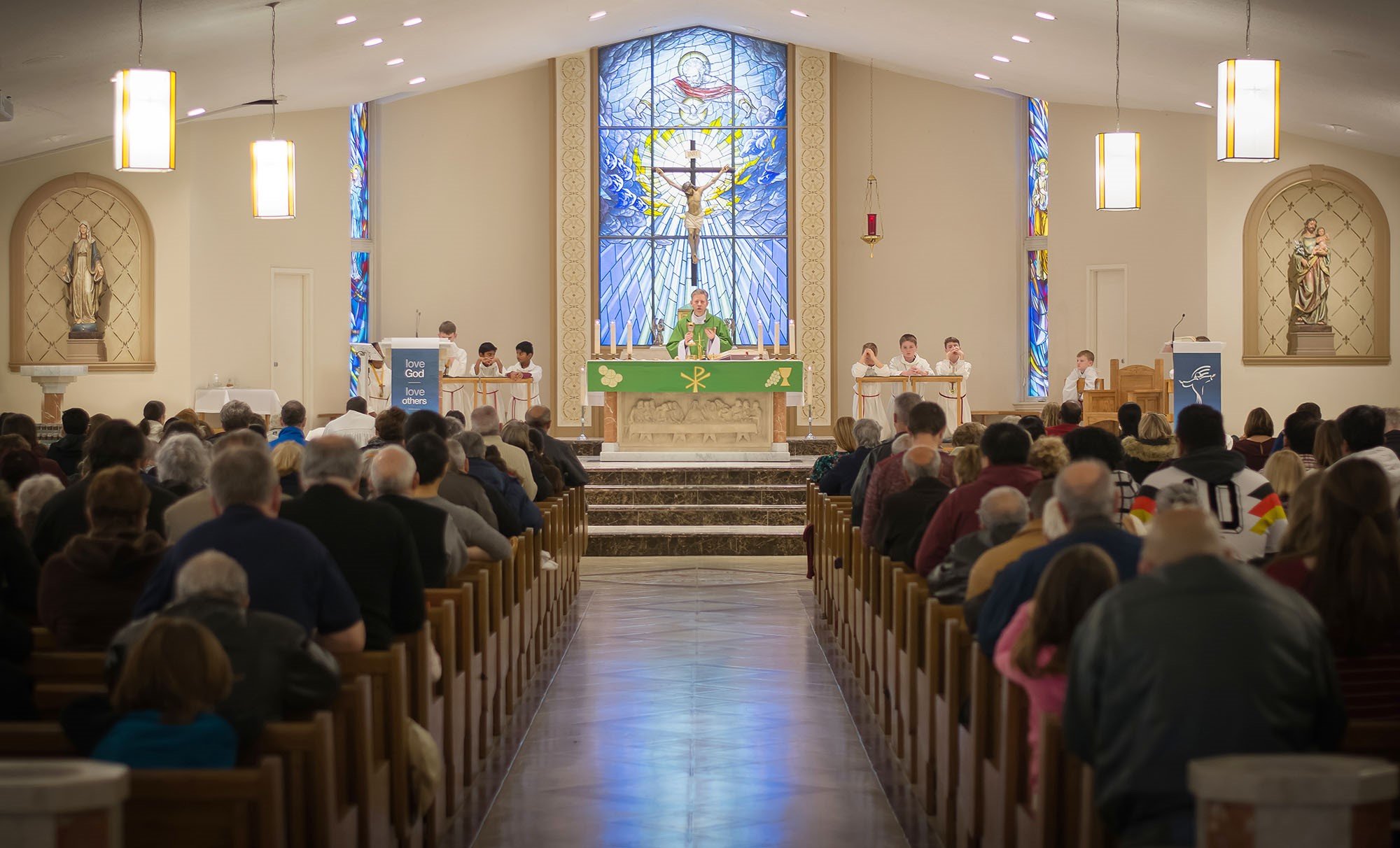 people in side the church and priest