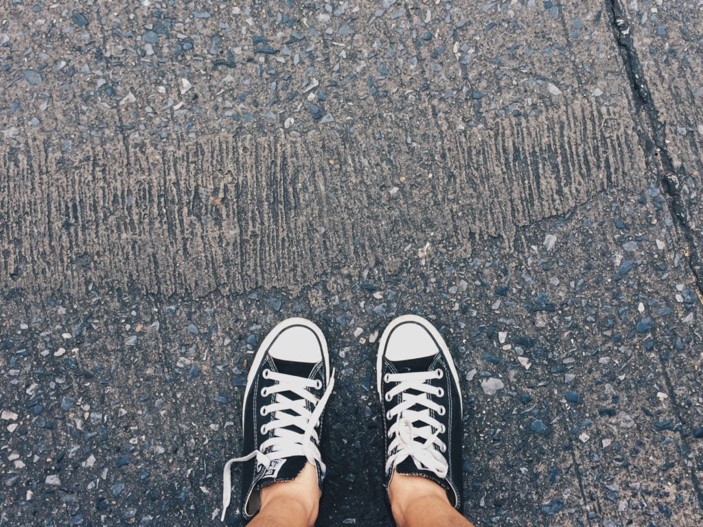 youth shoes on pavement